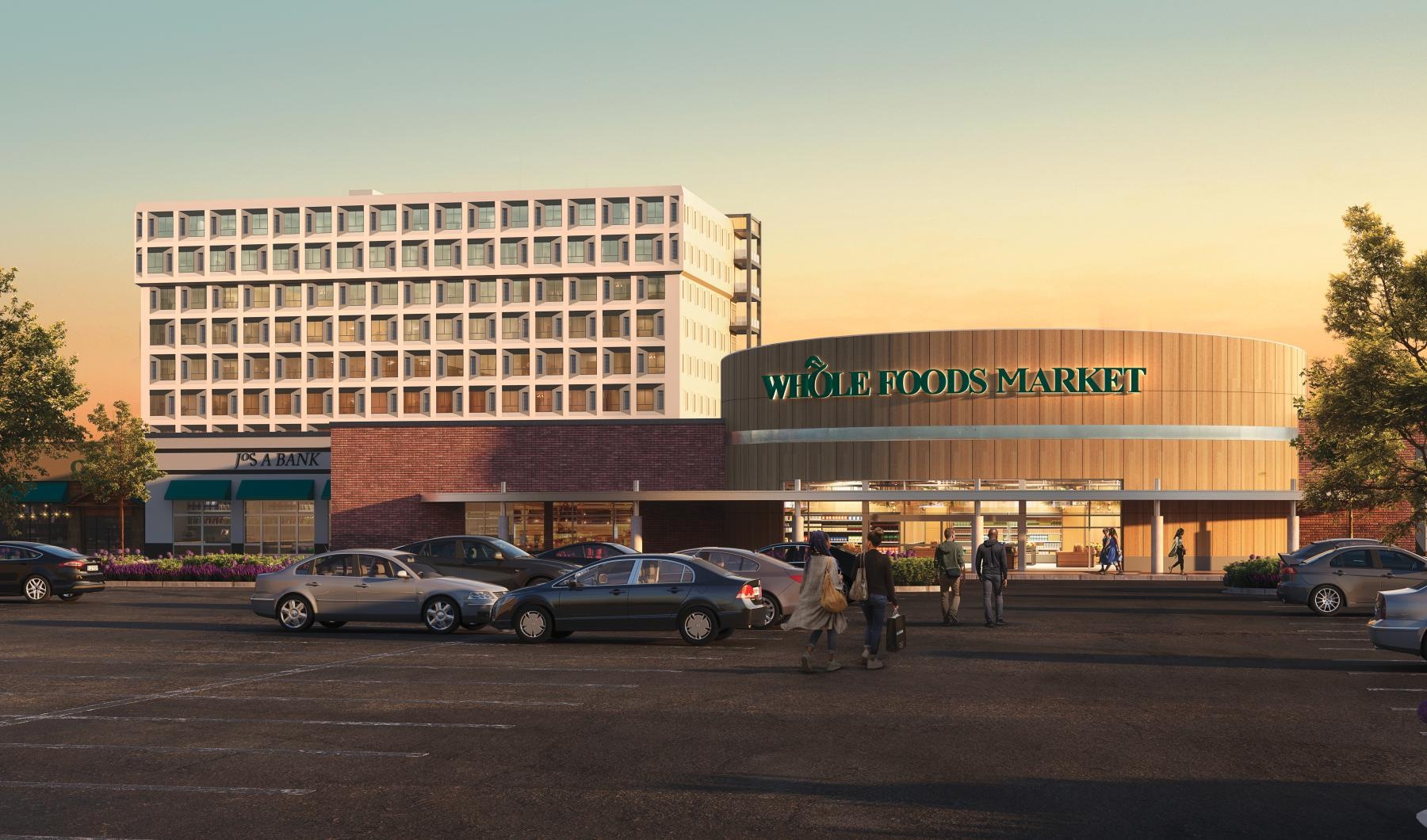 a parking lot with cars and people