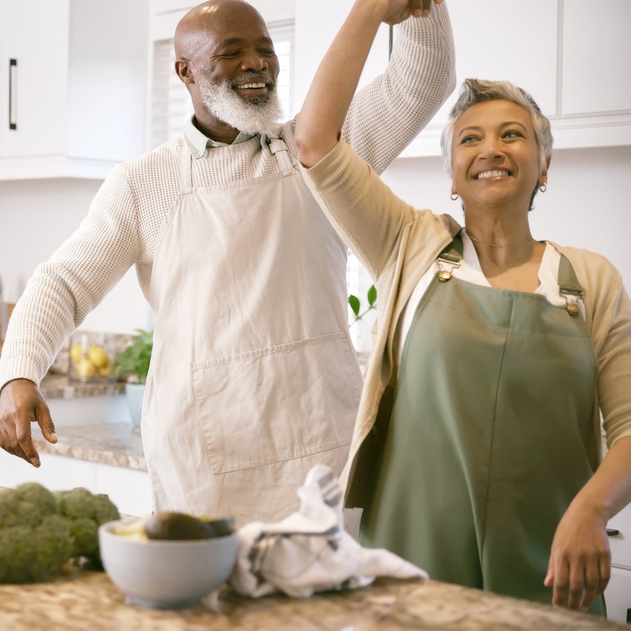 a couple in a kitchen